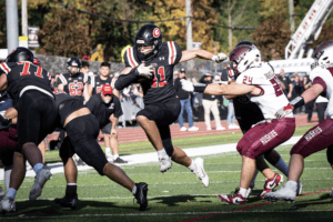 Chris Iuliano evades a tackler during Rye's 24-0 win over Harrison on Oct. 26.